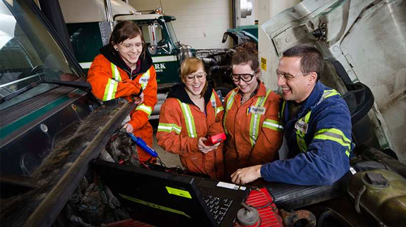 Female students learning in the heavy duty foundation program