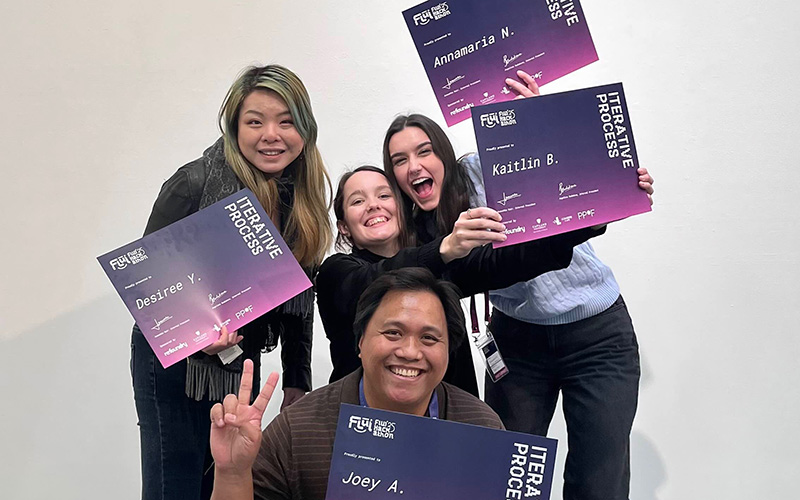 Four design students with their awards
