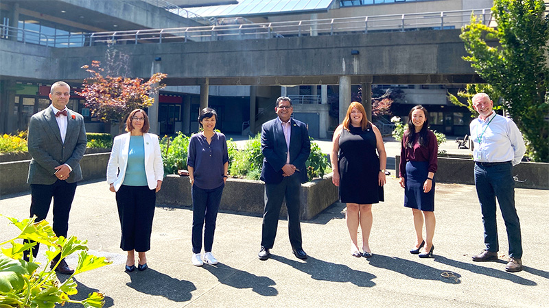 Photo of leadership team in Broadway courtyard