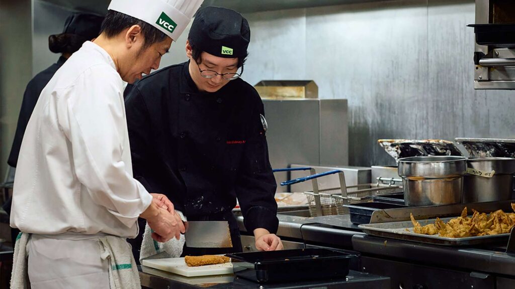 A VCC Asian Culinary Arts student with a course instructor