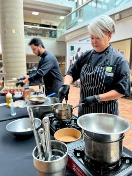 Chefs cooking food at an on campus food workshop