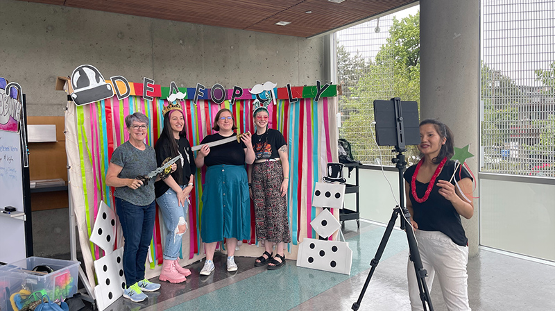 DDW attendees posing at photobooth