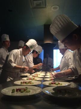 Students plating at the Chef's Table - Pop-up Kitchen.