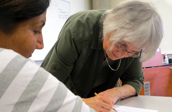 Leanor Vlug, instructor for Deaf and hard of hearing students, doing sign language.